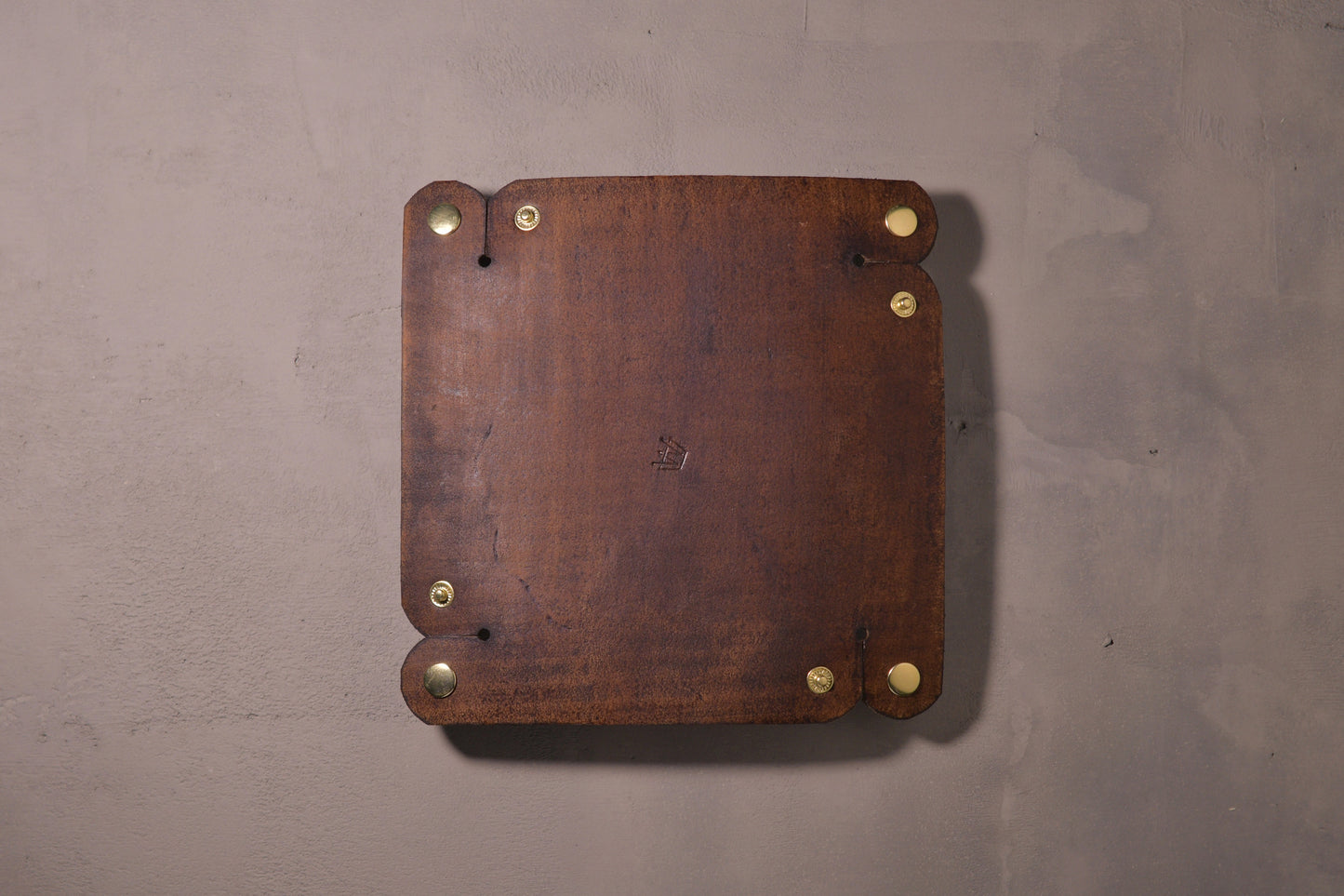 Folding Catchall with brass snaps, brown veg tan leather, hand made (unfolded/flat, back side with logo)