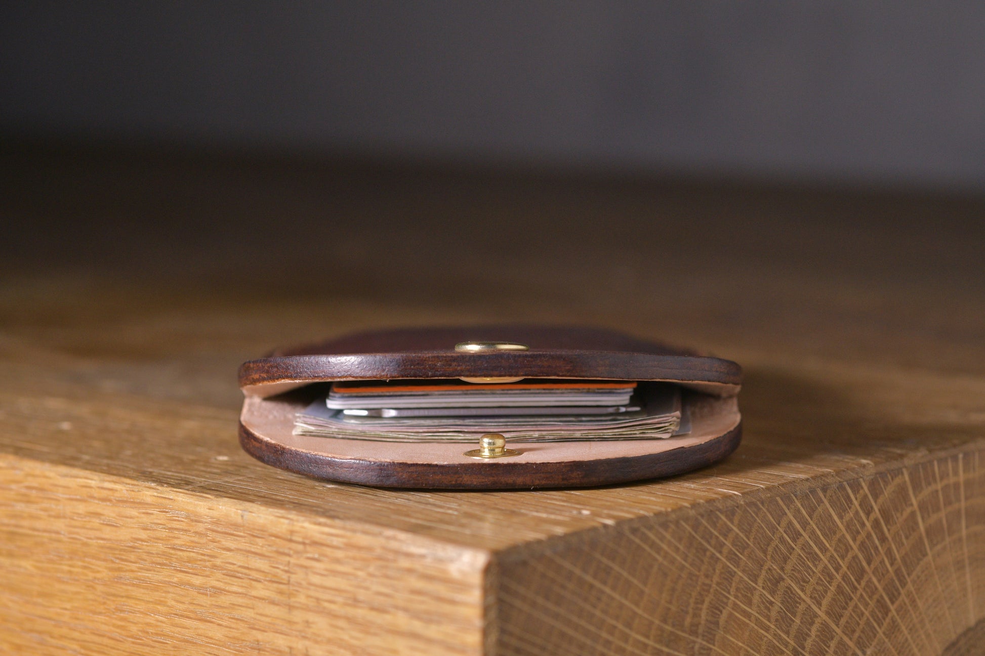 Minimal single pocket cash wallet with brass snap closure and pop open mechanism, brown veg tan leather, hand made (inside)