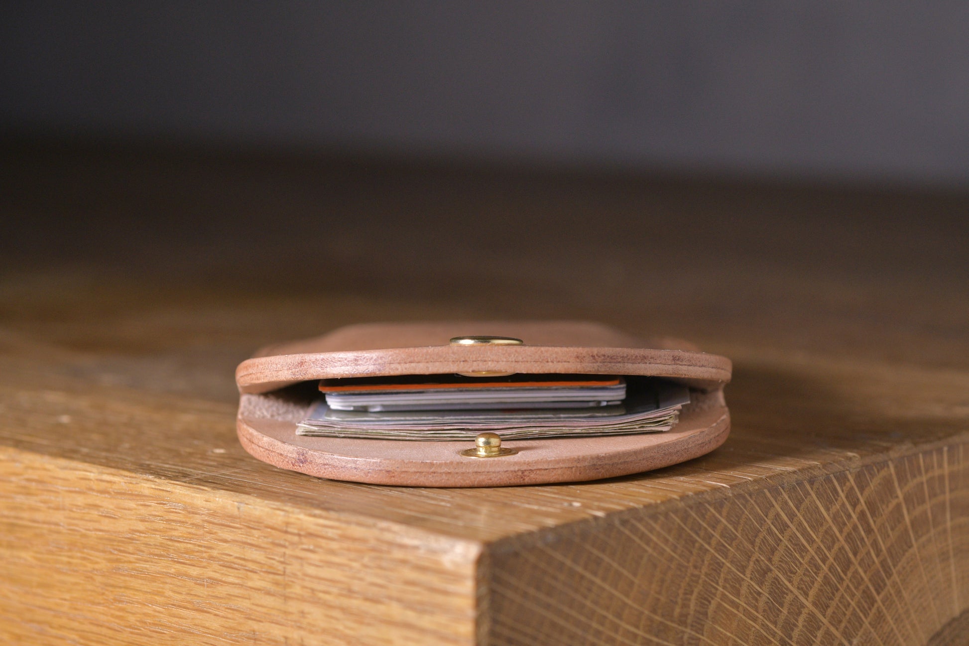 Minimal single pocket cash wallet with brass snap closure and pop open mechanism, natural veg tan leather, hand made (inside)
