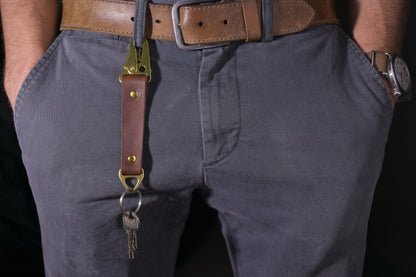 Keychain with carabiner style clip and brass hardware, brown veg tan leather, hand made (attached to belt loop with keys)