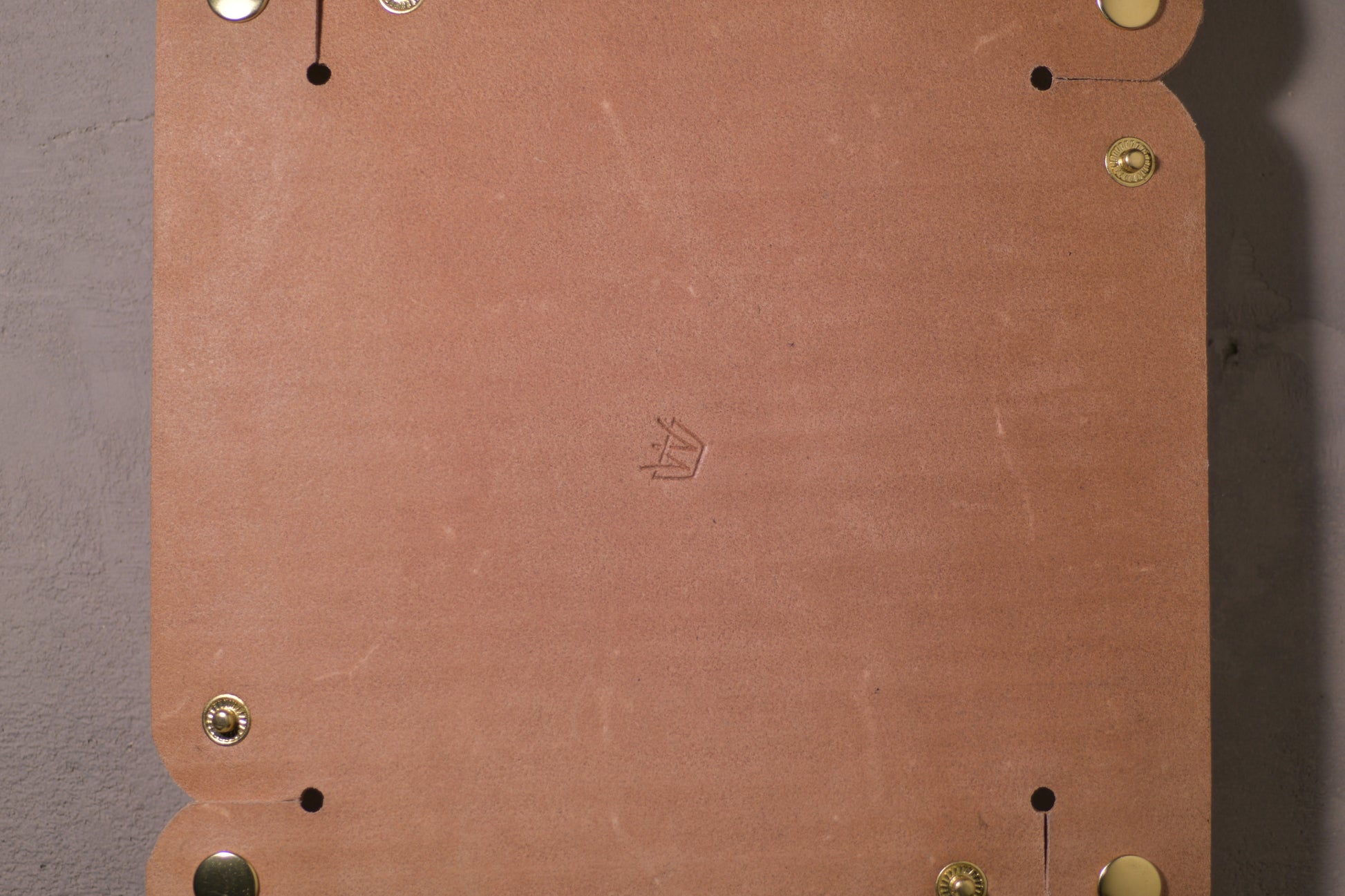Folding Catchall with brass snaps, natural veg tan leather, hand made (unfolded/flat, back side with logo, close up)
