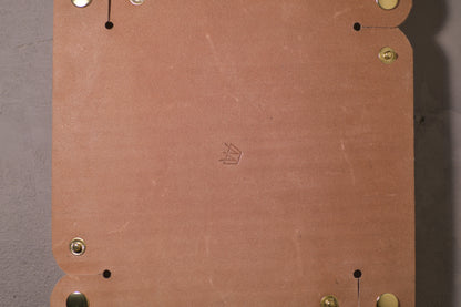 Folding Catchall with brass snaps, natural veg tan leather, hand made (unfolded/flat, back side with logo, close up)