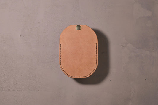 Minimal single pocket cash wallet with brass snap closure and pop open mechanism, natural veg tan leather, hand made