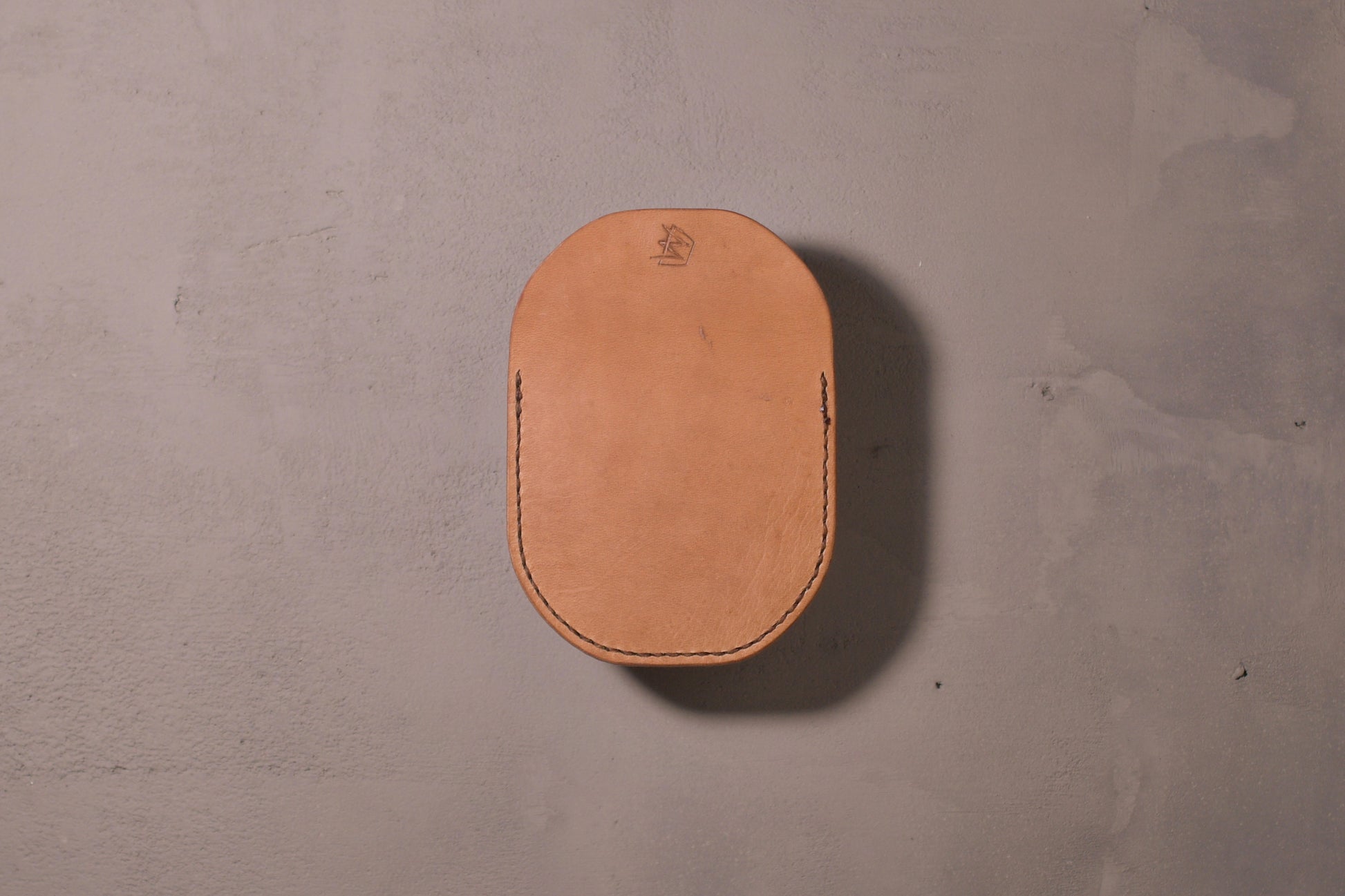 Minimal single pocket cash wallet with brass snap closure and pop open mechanism, natural veg tan leather, hand made (back)