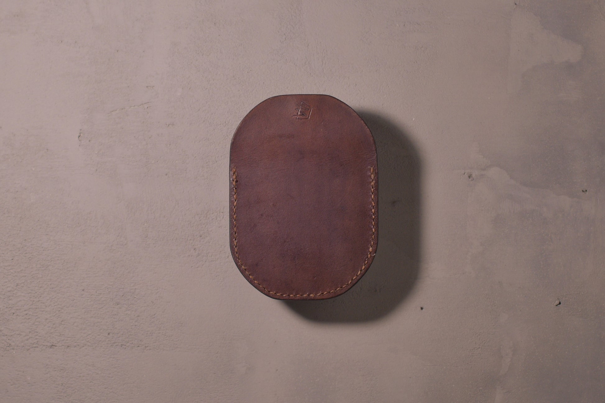 Minimal single pocket cash wallet with brass snap closure and pop open mechanism, brown veg tan leather, hand made (back)