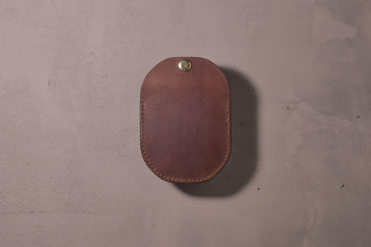 Minimal single pocket cash wallet with brass snap closure and pop open mechanism, brown veg tan leather, hand made