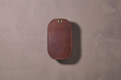 Minimal single pocket card wallet with brass snap closure and pop open mechanism, brown veg tan leather, hand made