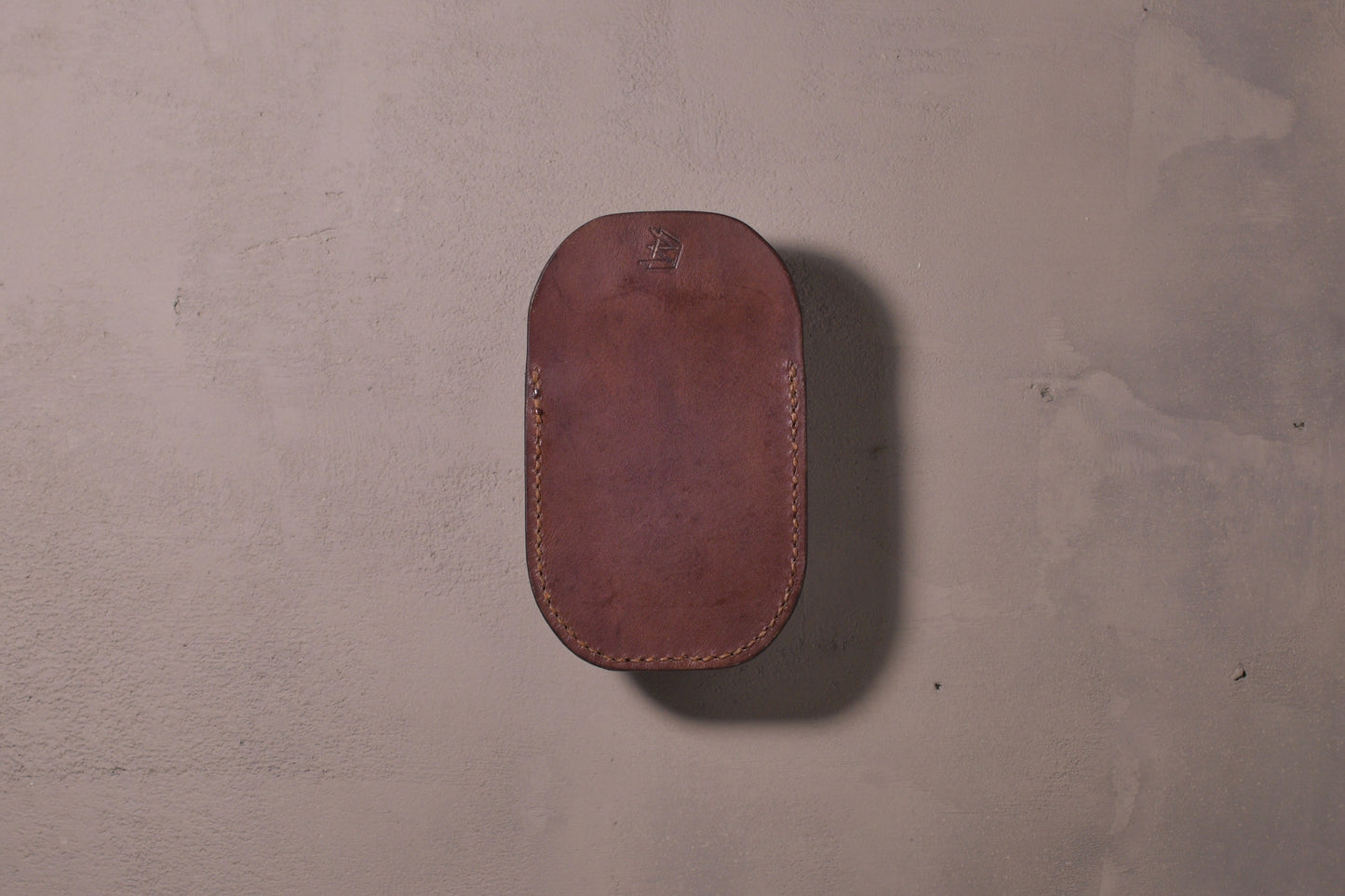 Minimal single pocket card wallet with brass snap closure and pop open mechanism, brown veg tan leather, hand made (back)