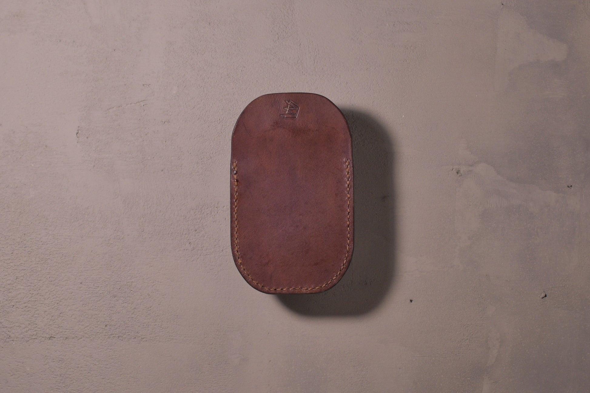 Minimal single pocket card wallet with brass snap closure and pop open mechanism, brown veg tan leather, hand made (back)