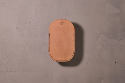 Minimal single pocket card wallet with brass snap closure and pop open mechanism, natural veg tan leather, hand made (back)