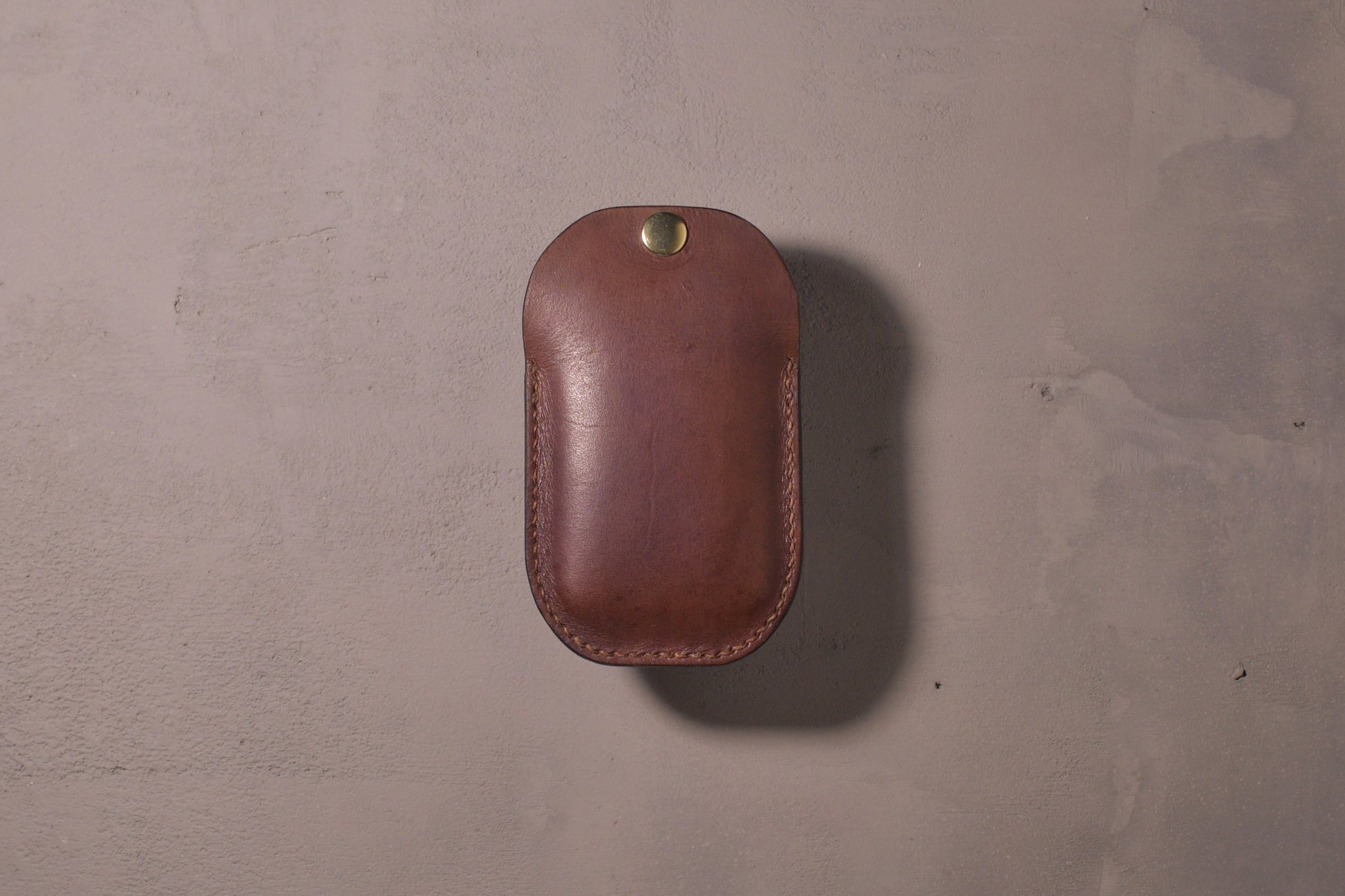 Minimal single pocket card wallet with brass snap closure and pop open mechanism, brown veg tan leather, hand made (full)