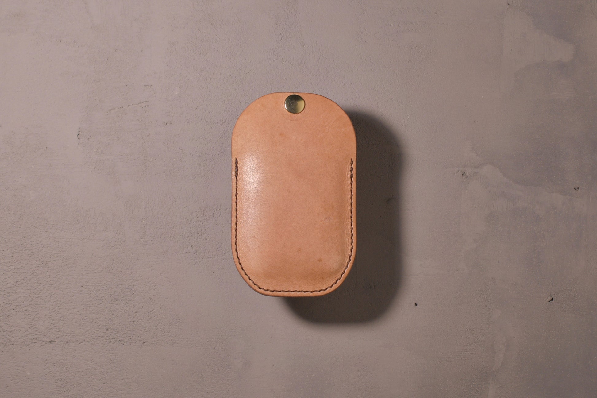 Minimal single pocket card wallet with brass snap closure and pop open mechanism, natural veg tan leather, hand made (full)